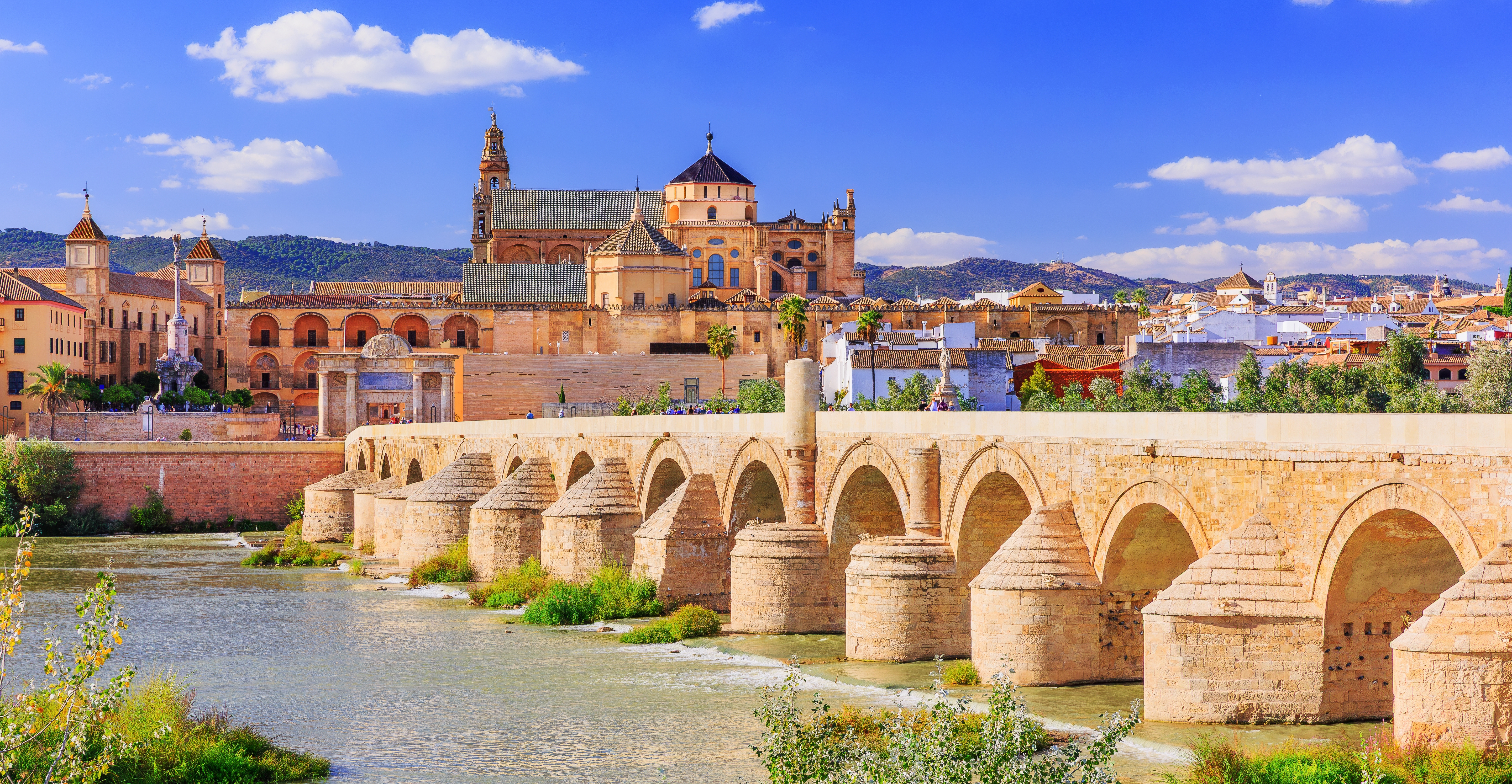 Córdoba, Spain. Roman bridge and Mezquita (mosque-cathedral) on the Guadalquivir River